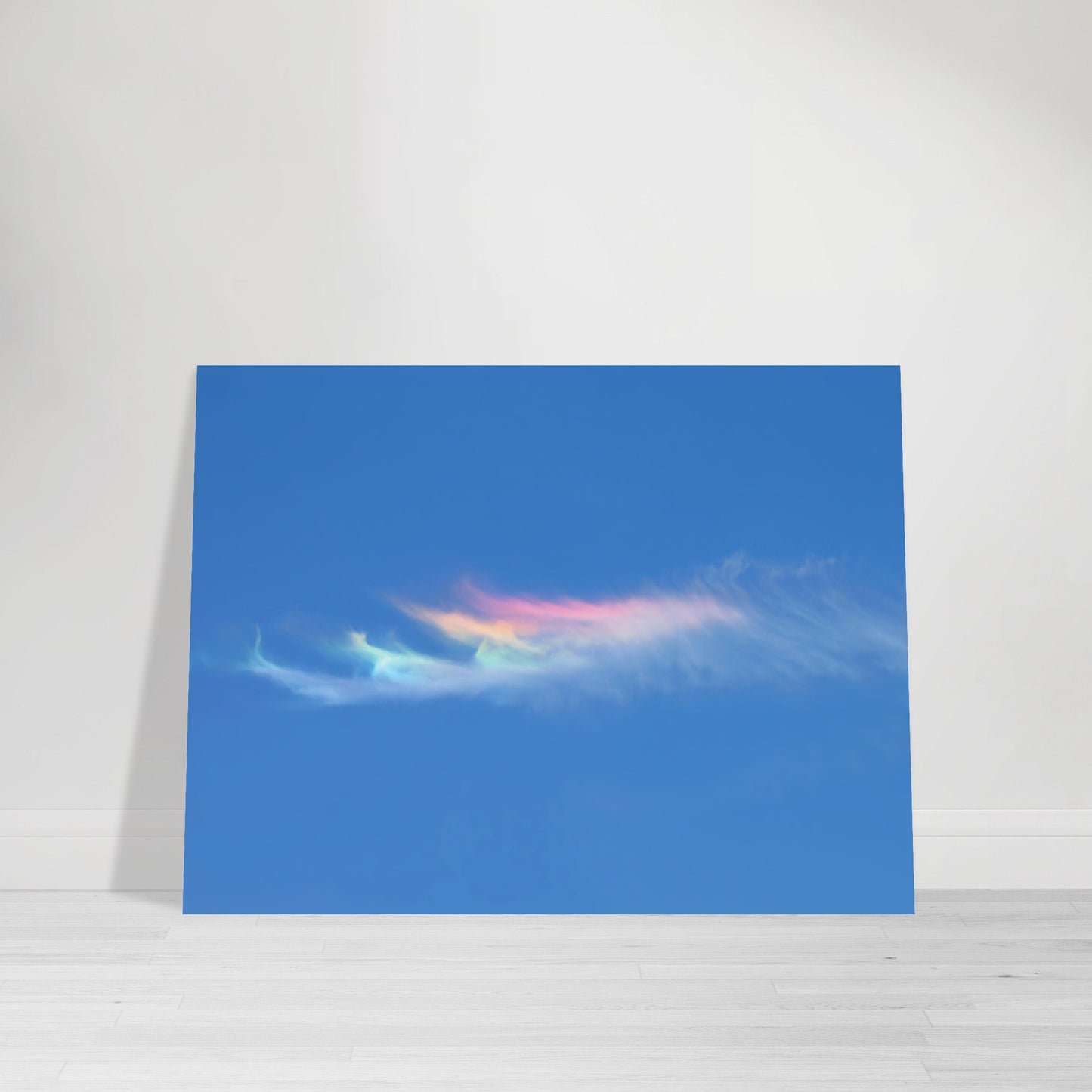 Photographic print capturing a blue sky adorned with a rainbow colored cloud taken in Marfa Texas by Allison Cartwright , Found Art Studio.