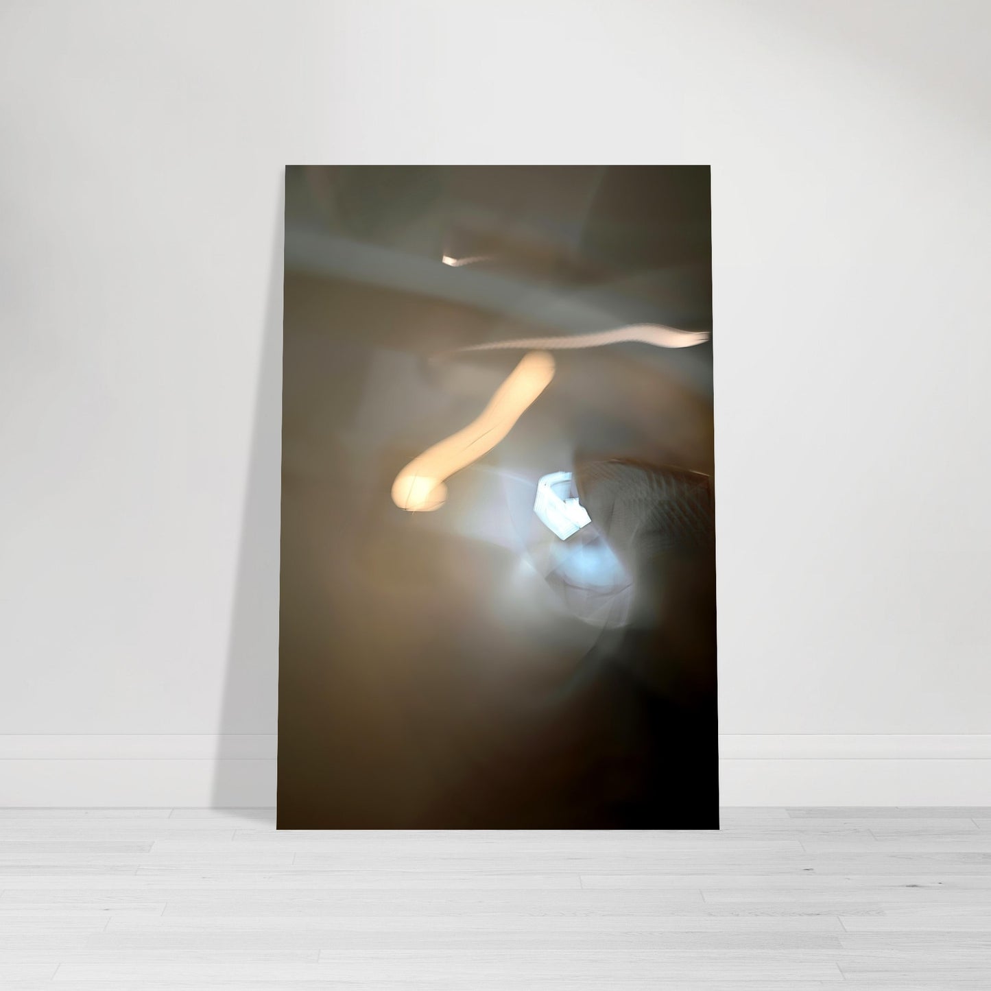 Abstract Photographic Print showcasing mesmerizing swirls of vibrant colors resembling a cosmic dance in colors of deep brown, tan, gray, black, light blue, and yellow by Allison Cartwright of Found Art Studio